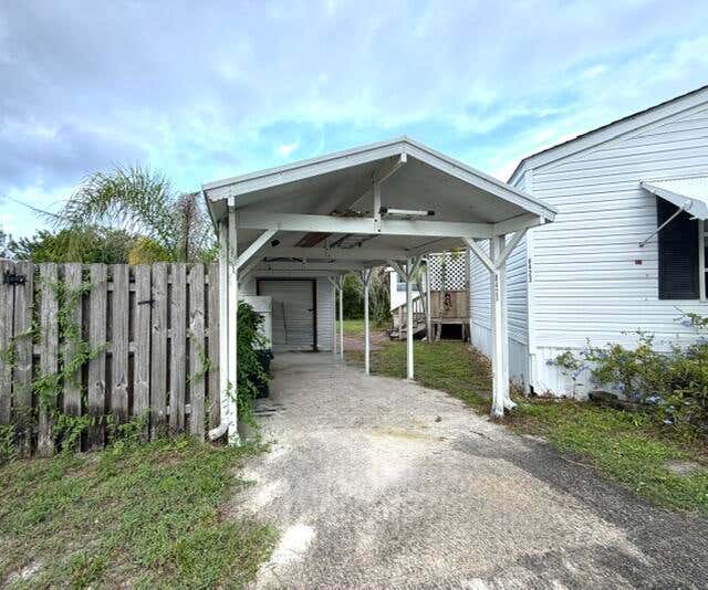 Photo of 8423 SE Sandy Lane, Hobe Sound, FL 33455 (MLS # B26054415)