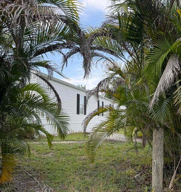 Photo of 8423 SE Sandy Lane, Hobe Sound, FL 33455 (MLS # B26054415)