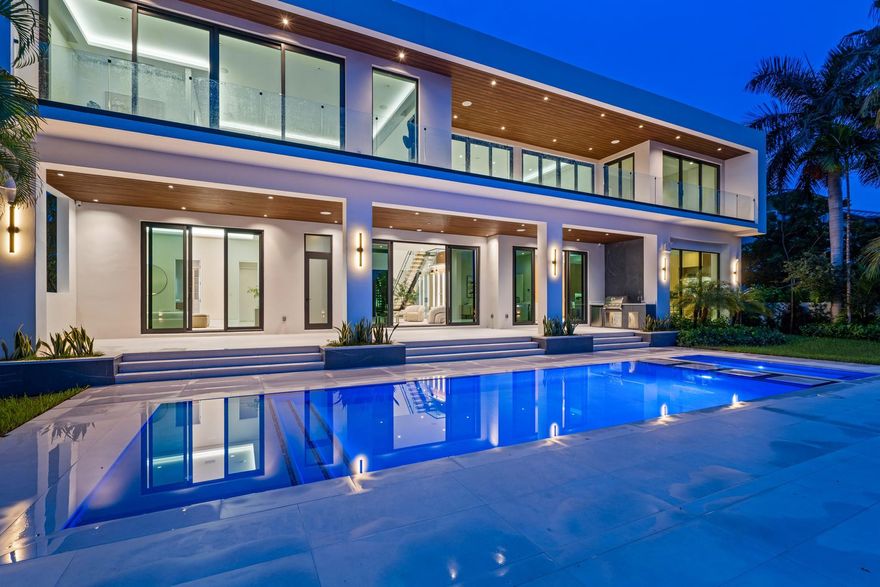 Step into refined coastal living with this stunning, architect-designed modern waterfront home in exclusive Seven Isles. A dramatic two-story entry leads to 7 en-suite bedrooms, a dedicated office, and a bonus room in the luxurious primary suite complete with sauna and steam. Walls of glass fill the home with natural light and peaceful water views. Enjoy 100'± of water frontage, a full-length concrete dock, and direct ocean access. some of the features include a spacious upstairs family room, lift-ready 4-car garage with epoxy floors, Control4 smart system, custom cabinetry, hot and cold plunge spa, covered terraces for entertaining, and exceptional finishes. Tons of light and open spaces.  Just minutes to beaches, shops, restaurants and international airports. By appointment only. DISCLAIMER: Information published or otherwise provided by the listing company and its representatives including but not limited to prices, measurements, square footages, lot sizes, calculations, statistics, and videos are deemed reliable but are not guaranteed and are subject to errors, omissions or changes without notice. All such information should be independently verified by any prospective purchaser or seller. Parties should perform their own due diligence to verify such information prior to a sale or listing. Listing company expressly disclaims any warranty or representation regarding such information. Prices published are either list price, sold price, and/or last asking price. The listing company participates in the Multiple Listing Service and IDX. The properties published as listed and sold are not necessarily exclusive to listing company and may be listed or have sold with other members of the Multiple Listing Service. Transactions where listing company represented both buyers and sellers are calculated as two sales. “No payments made until title passes” Some affiliations may not be applicable to certain geographic areas. If your property is currently listed with another broker, please disregard any solicitation for services. Information published or otherwise provided by seller, listing company or its representatives is deemed reliable but are not guaranteed and subject to errors, omissions, or changes without notice. Copyright 2026 by the listing company. All Rights Reserved.