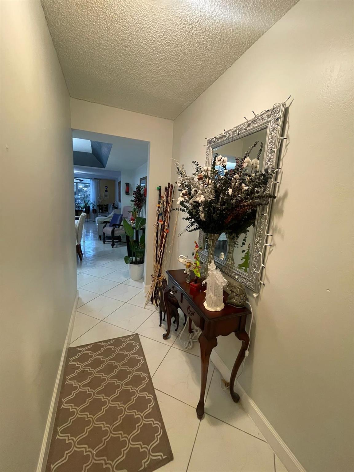 GORGEOUS corner unit with garden views in the coveted International Village at Inverrary community. Come see This stunning 2 BR / 2 BA condo unit has upgraded kitchen and bathrooms, laundry in unit and a covered balcony. Features include a LARGE living room, storage room, and a separate dining area which could be used as a small bedroom or office space. Included 24 hour gate, grounds security, gym, pool, sauna, racquetball, tennis, and clubhouse. Water, trash, and basic cable included in monthly maintenance. Association restrictions apply. Pet restrictions apply.