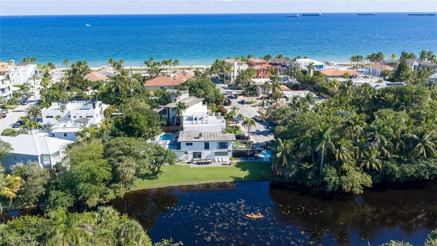 Prime location one block from Fort Lauderdale Beach & steps from Birch State Park. This reimagined two-story waterfront home sits on a quiet lagoon with direct paddleboard access, offering a rare blend of beach convenience & private retreat. The 5 bed 4 bath main home plus a 1 bed 1 bath guest suite creates flexible living for multigenerational needs, guests, or added income. Mid-century modern style, open living areas, a screened porch, an upper deck off the primary suite, & a heated saltwater pool elevate everyday living. Approved as a vacation rental with strong income potential, the property delivers comfort, access & a lifestyle that is hard to match. WATERFRONT IS NOT OWNED BY HOMEOWNER. Waterfront Lagoon is part of Birch State Park Property.  You can launch paddle boards and canoes.