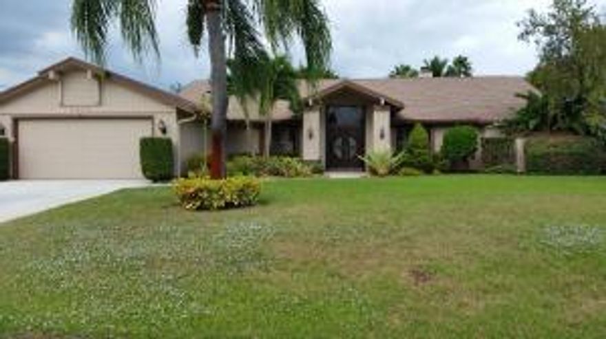 Spectacular and ultra spacious 4/2 luxury home with screened in pool. Nicely private fenced in back yard with beautiful landscaping. The kitchen is totally updated with granite, stainless, and a cook island with wine cooler. The huge Living room has lots of room to stretch out in front of the fireplace. There's also a whole house vacuum cleaner. Close to US1 shopping and just a few short minutes to the Turnpike. Must be seen to be truly appreciated. OWNER IS COVERING POOL AND LAWN CARE!!!