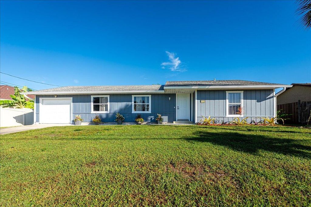 Photo of 1129 SW Jacqueline Avenue, Port Saint Lucie, FL 34953 (MLS # R11136627)