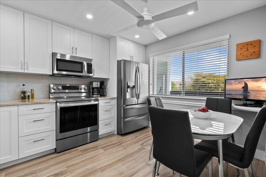 Welcome to your dream home in the highly desirable and impeccably maintained HAMLET AT POINCIANA! This beautifully renovated 3rd-floor condo offers the perfect blend of modern elegance, comfort, and convenience. Step inside to discover a spacious and inviting living area filled with natural light, tile flooring through-out the home, sliding glass doors that open to a serene enclosed patio with roll-down blinds — the perfect place to relax and enjoy the Florida lifestyle year-round. The stunning kitchen is thoughtfully updated with Quartz countertops, white shaker cabinets, stainless steel appliances, and stylish finishes that combine both beauty and functionality. This exceptional residence offers 2 spacious bedrooms, 2 full bathrooms, plus a versatile room ideal for a home office, hobby space, or additional storage. A full-size washer and dryer conveniently located inside the unit adds everyday practicality. Designed with privacy in mind, the split-bedroom floor plan creates a comfortable retreat for owners and guests alike. The spacious primary suite features a walk-in closet and a beautifully appointed ensuite bathroom. Enjoy peaceful mornings and breathtaking views from the all-seasons balcony with glass sliding doors and windows overlooking the community pool, lush trees, tranquil pond, fairways, and the scenic Poinciana Golf Course. Reasonable HOA dues include water, sewer, basic cable, and common area insurance. Roof 2024, no current or upcoming assessments. The condo also comes with one assigned parking space and ample guest parking. Residents enjoy a well-maintained elevator building with a sparkling private pool just steps away. Poinciana is an active, amenity-rich community ideally located near everything South Florida has to offer. Enjoy access to the clubhouse featuring an additional pool, Mel's Bistro & entertainment, pickleball, tennis, fitness center, pay-as-you-play golf, social activities, classes, and more! Conveniently situated just minutes from the Florida Turnpike, Wellington Green Mall, shopping, dining, medical facilities, and only a short drive to the beach, this is Florida living at its finest!