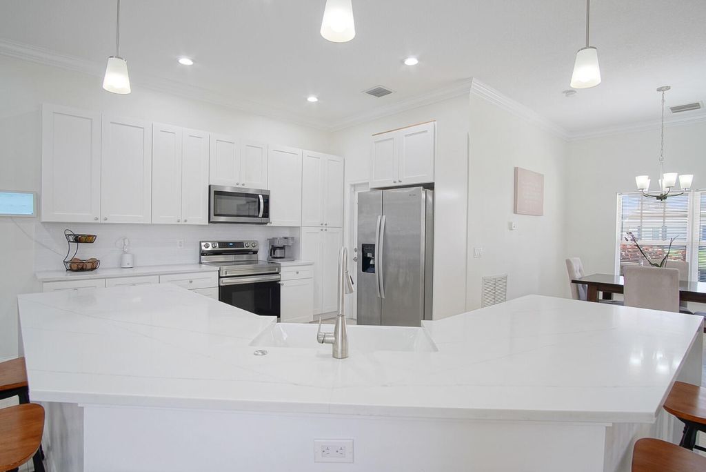 Photo of 719 SW Andrew Road, Port Saint Lucie, FL 34953 (MLS # B26015399)