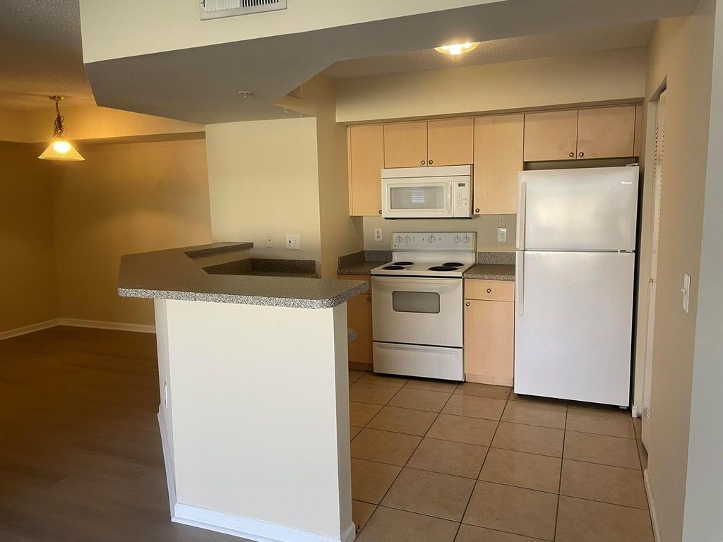 Photo of 3605 NW Adriatic Lane #7-103, Jensen Beach, FL 34957 (MLS # R10985207)