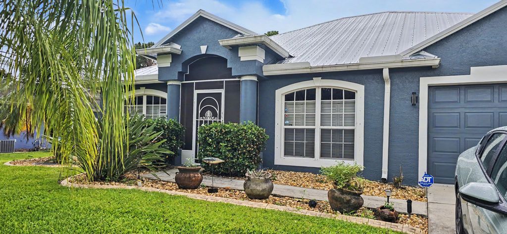 Photo of 1874 SW Nantucket Avenue, Port Saint Lucie, FL 34953 (MLS # B26037211)