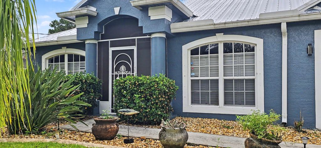 Photo of 1874 SW Nantucket Avenue, Port Saint Lucie, FL 34953 (MLS # B26037211)