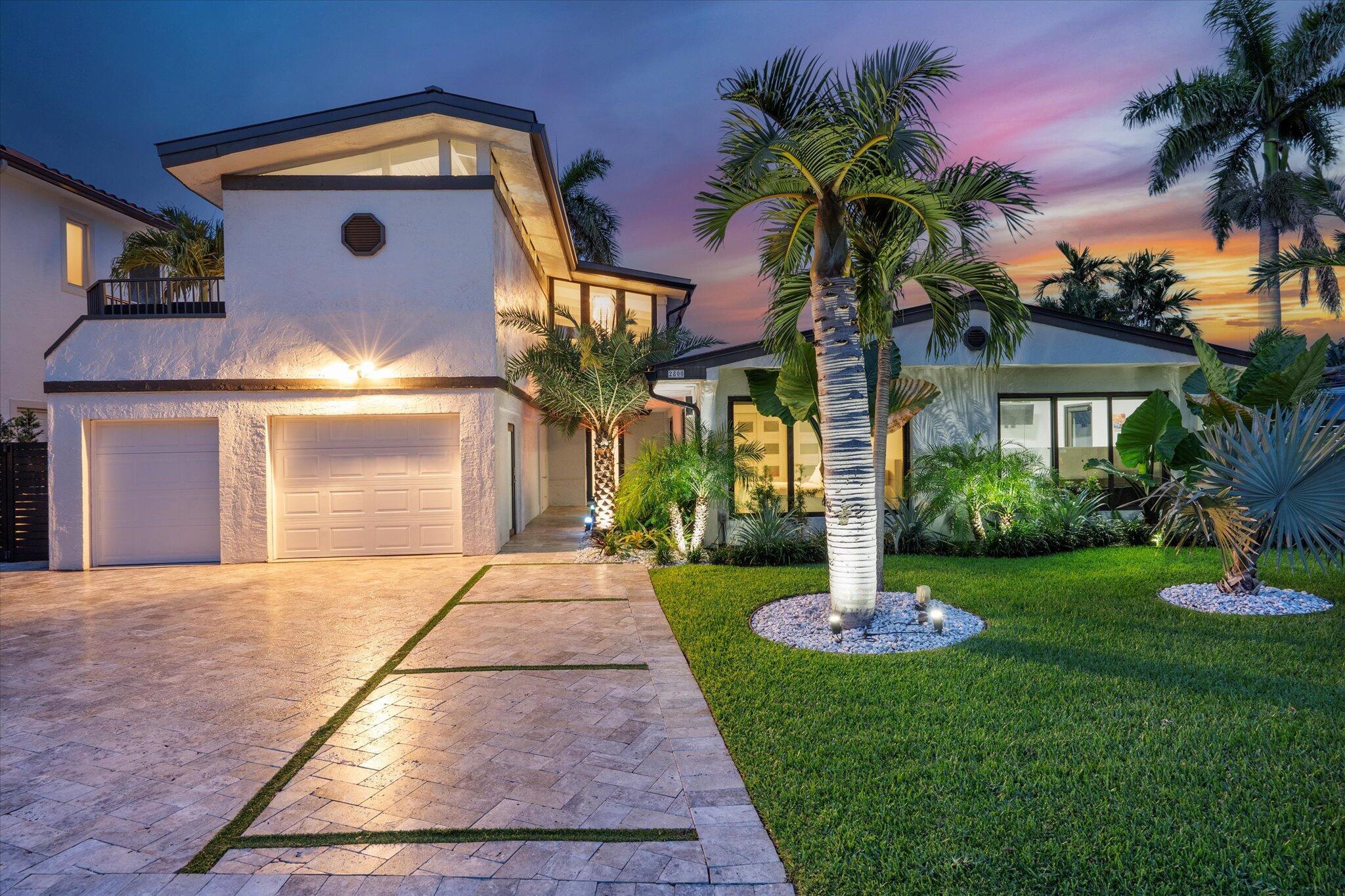 Located on a deepwater canal with no fixed bridges, this extensively updated single-family home features over $500,000 in upgrades completed within the last two years, offering the best of South Florida living--whether you're an avid boater, outdoor entertainer, or simply looking for a move-in-ready waterfront property. The home includes an 80-foot dock, fully rebuilt in 2024 with raised concrete (to 5.0 elevation), along with a 24,000 lb boat lift. A new aluminum roof was installed in 2024, along with an upgraded electrical system and two new A/C units with all-new ductwork. The home has a split floor plan, with the primary suite located upstairs for added privacy and the additional bedrooms downstairs on the opposite side of the house.