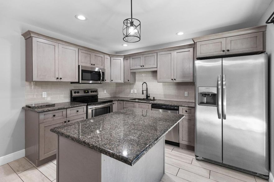 Beautifully updated unit-ALL AGES WELCOME! Don't miss this 2-bedroom, 2.5-bath home featuring a modern kitchen with stainless steel appliances, granite countertops, renovated bathrooms, in-unit washer and dryer, and a massive screened/covered & tiled front porch perfect for relaxing or entertaining. The owner's suite is spacious with it's own walk-in closet, vaulted ceiling, and private bath. Both bedrooms have sliders with accordion shutters to access the balcony.  2019 AC and Water Heater. Two parking spaces including carport covered space. Pet Friendly (2 PETS ANY SIZE). Just walking distance to clubhouse and amenities. HOA Covers Cable, Insurance-Bldg, Roof Maintenance, Lawn Care, Sewer, Water, Clubhouse, Pool, Pickleball and Shuffleboard. Fantastic Location With Easy Access To Shopping, Restaurants, Medical Centers, Boating, Parks, Florida Turnpike and I-95, Hutchinson Island Beaches. Only 2 Hours To Disney! Discover Paradise On The Treasure Coast With Top-Notch Water Sports, World Class Golf, & The Best In Boating & Fishing!!