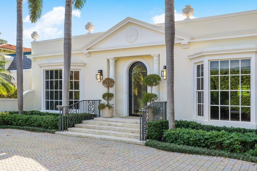 Welcome to 168 Kings Rd, a Classic Palm Beach Regency home located in the prestigious Estate Section of Palm Beach. This residence sits on an oversized 16,000 + sq ft lot and features a versatile 5 bedroom, 6.5 bath layout with generous ceiling heights and spacious rooms, making it an ideal space for entertaining and hosting guests. The backyard offers a private retreat centered around a large, heated saltwater pool, complete with a covered area for dining and relaxation. Modern amenities include dual bathrooms in the primary suite, a wet bar, 1,000 bottle wine storage, impact glass, full house generator and air-conditioned 2-car garage. Conveniently located to all the Palm Beach lifestyle has to offer.
