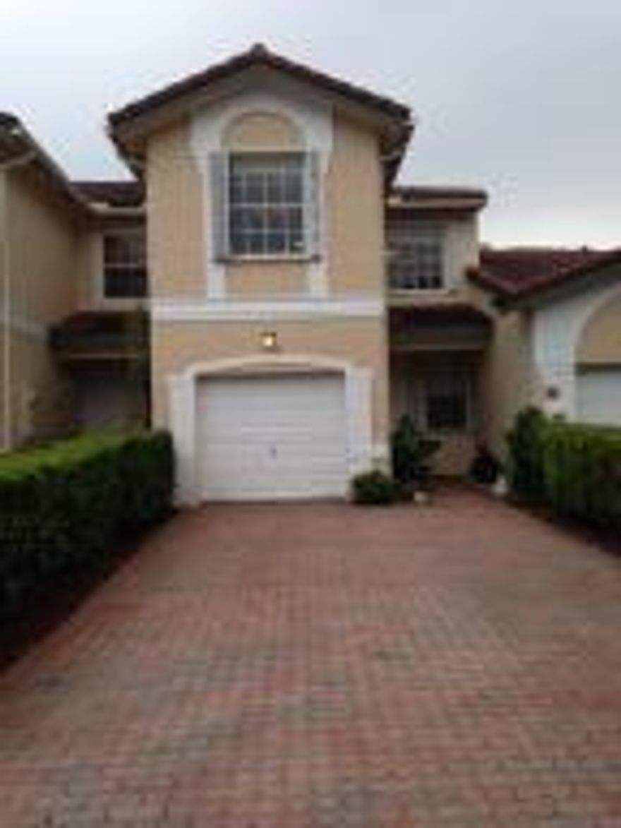 Nice  Townhome located  on a Cu de Sac in sought after  Wyndham Lakes of Coral Springs.  LONG  DRIEWAY . Laminate and Tile . Hurricane Accordian. No neighbor at the back . Walk to pool with extra parkings .  Hurry . It will be gone soon !