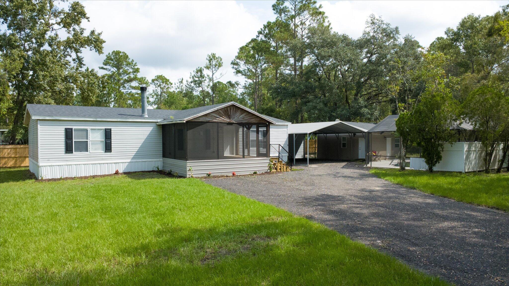 Move-in ready 3BR/2BA home with pool, pool house & carport! This spacious double-wide manufactured home offers over 1,500 sq. ft. of living space with Luxury Vinyl Plank flooring throughout, ceiling fans in every room, and a smart layout for daily living and entertaining. The modern kitchen features a refrigerator, stove, microwave, and dishwasher. Enjoy your private outdoor oasis with a sparkling pool and a 20x20 pool house--ideal for guests, office, or gym. A 25x24 carport offers ample covered parking or workspace. The partially fenced yard adds privacy for pets or play. Recent upgrades include a brand-new roof and water heater. Located in the peaceful Daytona North subdivision, this home blends comfort, function, and Florida lifestyle at a great value!