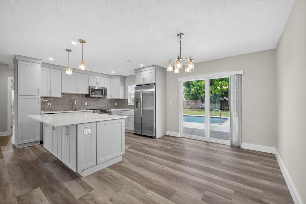 Photo of 316 La Mancha Avenue, Royal Palm Beach, FL 33411 (MLS # R11117877)