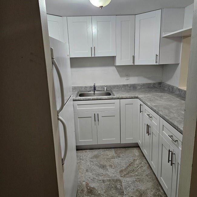 Nice unit on first floor in gated building. Brand new white cabinet. New Bathroom with tub and vanity. Large living room, large bedroom. Stainless steel stove, ceramics floors throughout, walk in closet, Nice and clean unit. Screened porch. Pool view. Credit score of 675 is required.