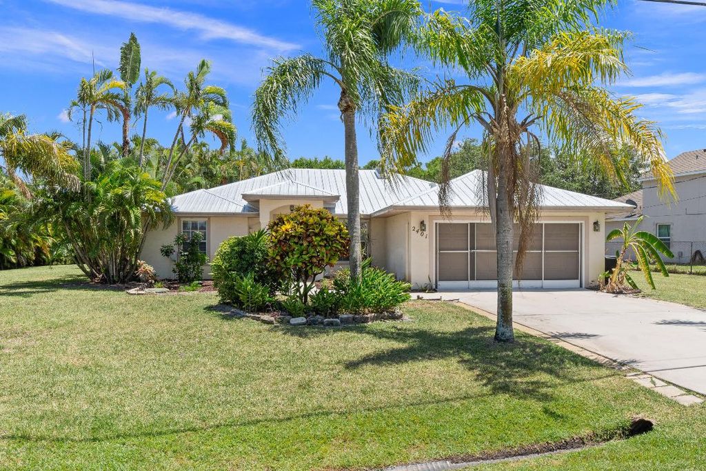 Photo of 2401 SE Rock Springs Drive, Port Saint Lucie, FL 34952 (MLS # R10996779)