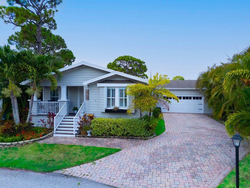 Welcome to this stunning updated modular home boasting 2-Beds, 2-Baths plus a flex den all on a desirable private corner lot! Enjoy an oversized paver driveway, 2-car garage, and a charming front porch perfect for morning coffee. Inside, the open floorplan features abundant natural light, tile floors, and elegant tray ceilings with crown molding. The updated kitchen has granite countertops, stainless steel appliances, a walk in pantry, plus a beautiful bar for entertaining guests. The master suite offers two walk-in closets, an ensuite bath with double vanities plus a walk-in shower. Additional highlights include inside laundry with sink, enclosed patio, new gas generator, water softener, and 4-year-old A/C. Enjoy resort-style amenities in Maralago Cay a 55+ community. Lot rent 1,319.69
