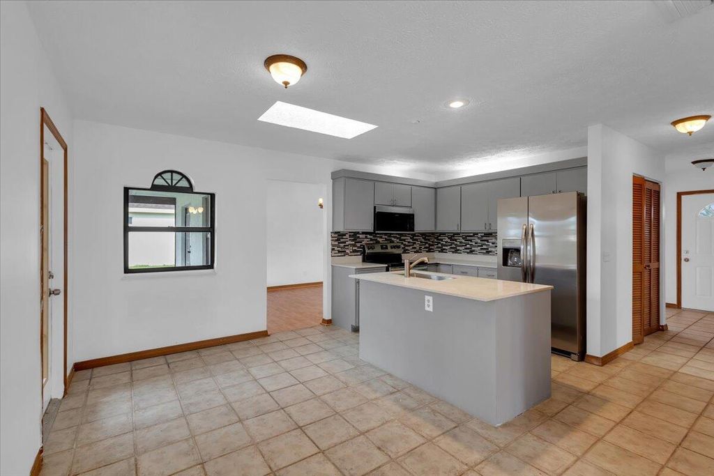 Photo of 514 SW Bailey Terrace, Port Saint Lucie, FL 34953 (MLS # R10923576)