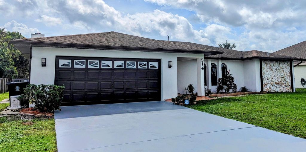 Photo of 514 SW Bailey Terrace, Port Saint Lucie, FL 34953 (MLS # R10923576)