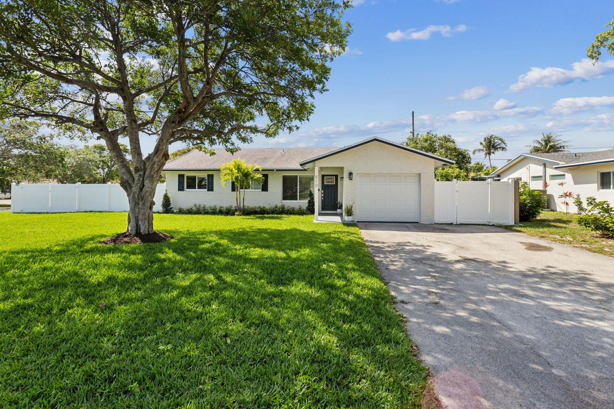 Welcome to this beautifully renovated single-family home in the heart of Delray Beach, ideally positioned on a rare 9,400 sq ft corner lot with no HOA. Just minutes from the ocean, vibrant Atlantic Avenue, and upscale Mizner Park, this location truly offers the best of South Florida living. Step into your own private backyard oasis, complete with a brand new custom-designed pool and elevated spa featuring multi-color LED lighting, a heater, and smartphone-controlled automation. Surrounded by sleek marble decking, this space is perfect for outdoor entertaining, relaxing, or enjoying the Florida sun in complete privacy. Inside, the home offers a seamless blend of modern comfort and thoughtful upgrades.