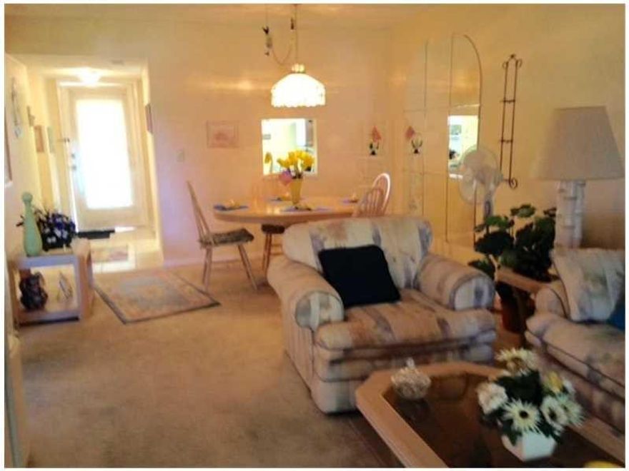 BRING YOUR TOOTHBRUSH, TOTALLY TURNKEY. LOVINGLY MAINTAINED UNIT, ENCLOSED BALCONY USED AS BEDROOM WITH A/C. NEW ROOF WITH 20 YEAR WARRANTY. STEPS TO CLUBHOUSE & HEATED POOL. TOP FLOOR OF ELEVATOR BLDG. SHOWS BEAUTIFULLY. LESS THAN 3 MILES TO OCEAN. 55+