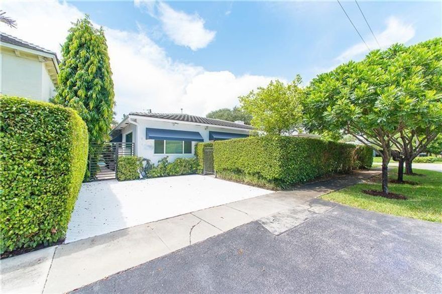 A beautifully renovated and spacious Victoria Park 2 bedroom 1 bath apartment. This apartment is attached to a single family home on a corner lot, but it has a gated, private entrance with a private yard, patio and raised, covered deck to enjoy the beautiful South Florida weather.  Unit has been renovated with wood floors, granite counters, wood cabinetry. There are built ins and draping. Washer and Dryer in the unit with dedicated parking.  Utilities are not included.