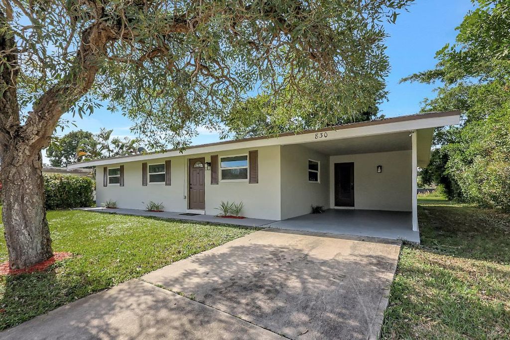 Photo of 830 SW Airoso Boulevard, Port Saint Lucie, FL 34983 (MLS # R10947559)