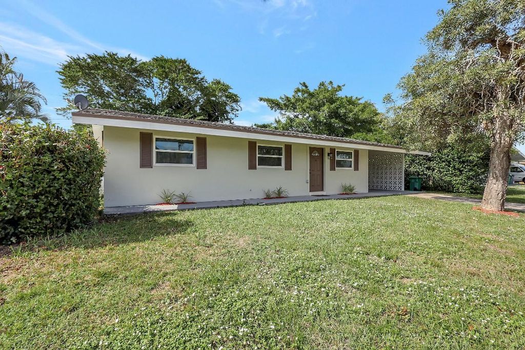 Photo of 830 SW Airoso Boulevard, Port Saint Lucie, FL 34983 (MLS # R10947559)