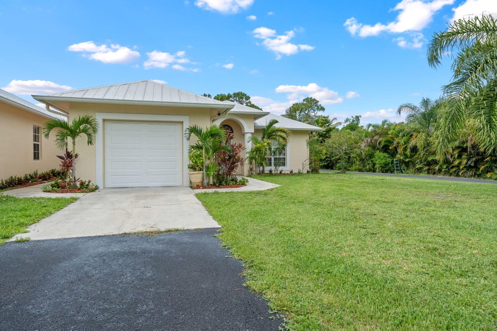 Photo of 12094 Citrus Grove Boulevard, West Palm Beach, FL 33412 (MLS # R11115123)