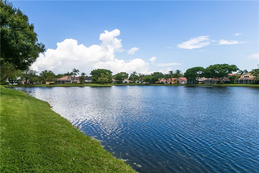 FANTASTIC OPPORTUNITY TO PURCHASE THIS 3 BEDROOM, 2 BATH HOME ON A LAKE IN PLANTATION'S HIGHLY DESIRABLE SUNSET COVE*24 HOUR MANNED GATED COMMUNITY IN THE HEART OF CENTRAL PARK*NEW ROOF(2022)* SPLIT BEDROOM FLOOR PLAN*SPACIOUS MASTER BEDROOM WITH WALK IN CLOSET *LARGE MASTER BATHROOM WITH DUAL SINKS, SEPERATE TUB & SHOWER* KITCHEN OPENS TO THE FAMILY ROOM*VAULTED CEILINGS*INTERIOR LAUNDRY ROOM*TILE FLOORS IN MAIN LIVING AREA*TWO CAR GARAGE*SCREENED IN PATIO WITH PEACEFUL VIEW OF LAKE*EXTERIOR PAINTED IN 2019*ENJOY THE HEATED COMMUNITY POOL*