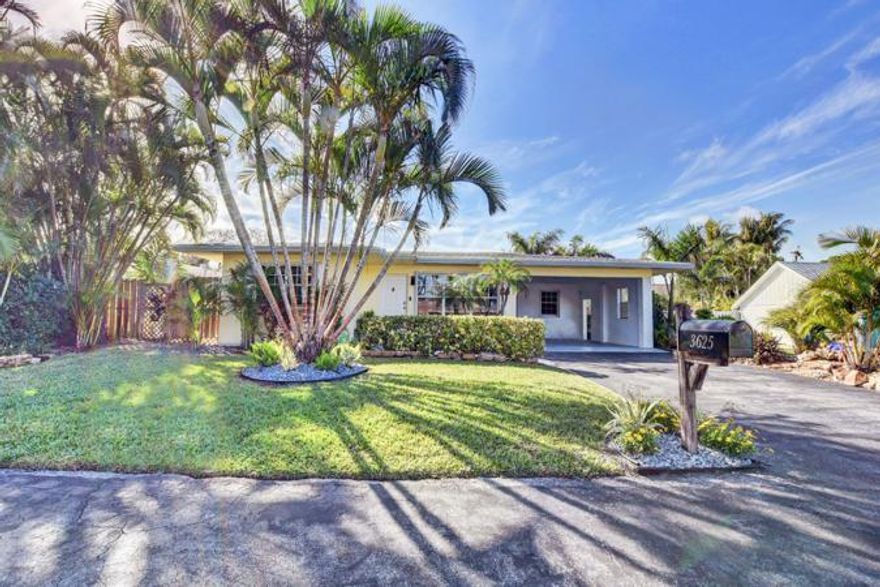 Your new tropical paradise awaits!  This absolutely gorgeous home features so many upgrades throughout.  Bright open kitchen concept, with quartz counters, subway tile back splash,  a center island and a separate breakfast counter!! Stainless steel appliances, an energy efficient gas stove and all less than 3 years old.  Beautifully tiled updated baths with seamless shower doors, and dual sinks in the master. She also comes with a New side porch, new generator, pool equipment, heater/chiller pump, travertine decking, impact door from back bedroom to pool area! And just wait until you get outside to your very own hidden oasis, out by your tranquil pool with its very own Tiki Hut, and lusciously landscaped  totally private fenced in yard. This total Gem will go fast so Hurry! Hurry! Hurry!