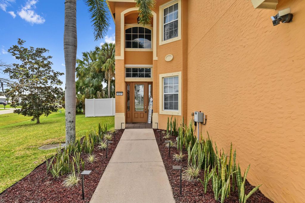 Photo of 1801 SW Hudson Street, Port Saint Lucie, FL 34953 (MLS # R10979415)