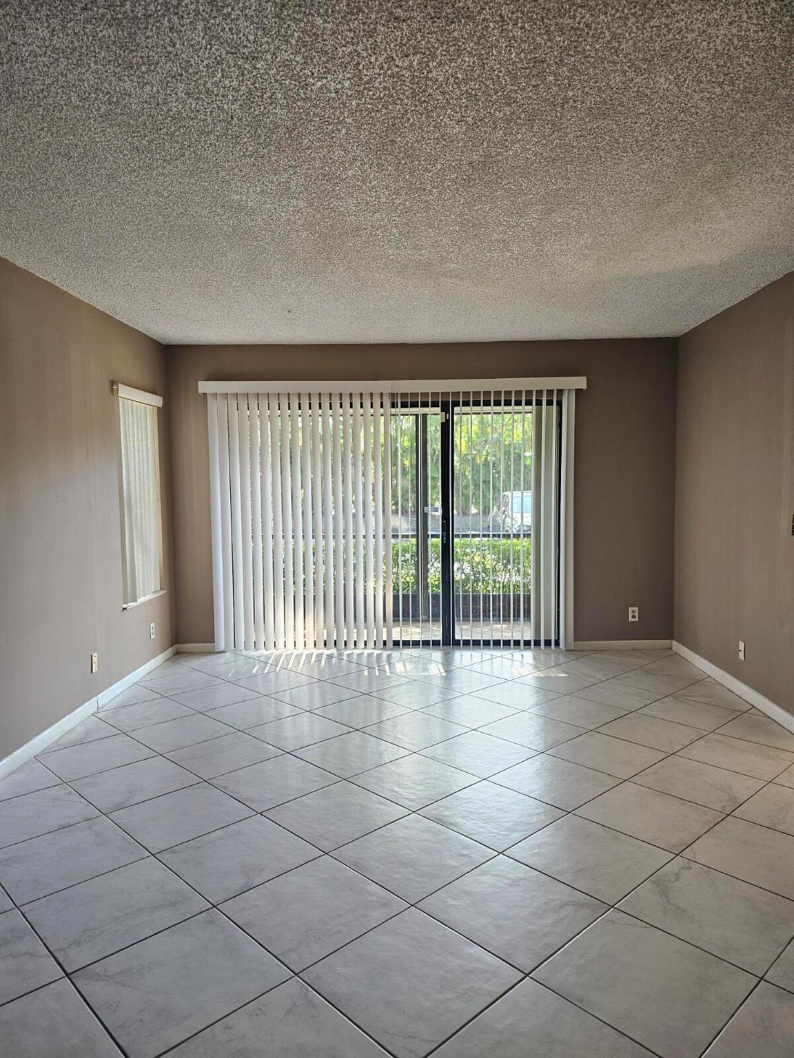 Beautifully Upgraded 2/2 Corner Unit in the Heart of Greenacres!Spacious first-floor corner unit located in a peaceful neighborhood and well-maintained community. This fully upgraded home features a tastefully remodeled kitchen with granite countertops, modern cabinets, and stainless steel appliances--including a French door refrigerator. Bathrooms are updated, and tile flooring runs throughout the entire unit. Enjoy the convenience of an in-unit laundry room with full-size washer and dryer. Close to major roads, shopping, dining, the airport, and more!