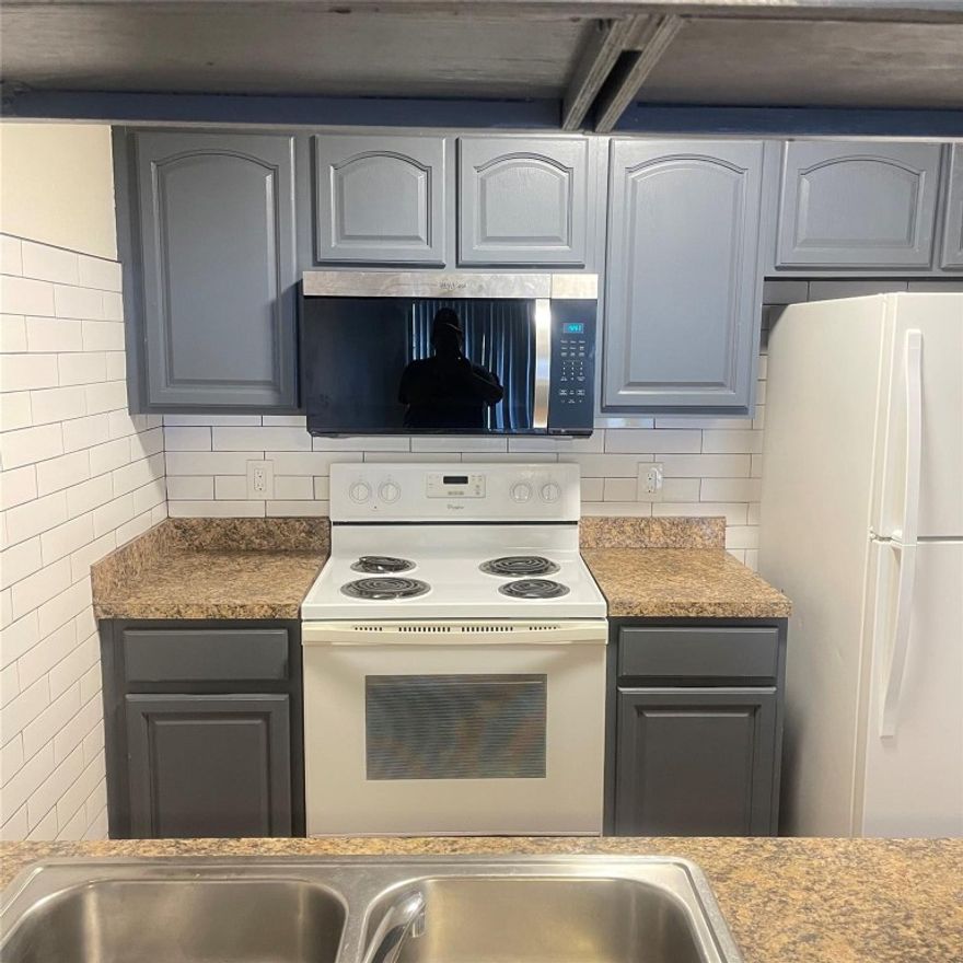 Stunning Modern Designer apartment- Clean with many new features. Private patio with fence. (2) Bed, (2) bath; 854 sqft, tiled floor, corner apartment in N.E. Ocala, with appliances (Stove, fridge, washer, dryer) & paved parking. New Stainless steel. Microwave to be installed prior to lease. Stunning Bathrooms one with tub one with shower featuring wall tile and sleek new black fixtures , new vanities both bathrooms and more. Entire apartment has new vinyl wood type flooring. Tenant pays all utilities.