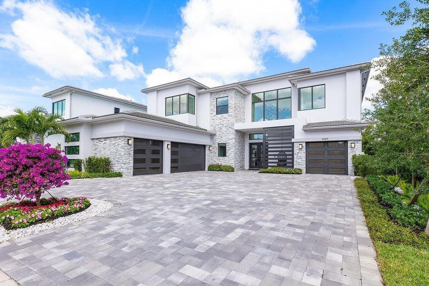 Welcome to a masterpiece of modern luxury in the exclusive Boca Bridges community. This custom-built Palermo Contemporary estate which is being sold Fully Furnished and Decorated transcends typical builder-grade homes, having been meticulously transformed by its visionary owners and designers.  Every inch of this residence reflects unparalleled craftsmanship, with extensive customizations, designer finishes, and thoughtful enhancements throughout.This two-story estate boasts an array of lavish amenities, including 5 spacious bedrooms, 61/2 elegantly appointed baths, a club room, and a state-of-the-art home theater with professional soundproofing--a six-figure investment in entertainment. The upstairs primary suite offers a private oasis with a morning kitchen and a wrap-around veranda.