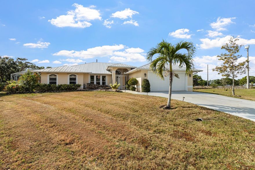Beautifully renovated and ideally located on a quiet culdesac, this Port Saint Lucie home delivers space, style, and flexibility with no HOA. Extensively updated in 2022, this 4 bedroom, 2.5 bath Single Family home offers 2,254 square feet of thoughtfully redesigned living space. The entire home features premium 24'' x 48'' porcelain tile throughout, fresh interior and exterior paint, updated lighting and ceiling fans, and newer moldings and baseboards that elevate the clean, modern aesthetic. The kitchen was fully redesigned with a highend Italian kitchen featuring high gloss cabinets imported from Italy, quartz countertops, a high end backsplash, stainless steel appliances, and a massive center island with a glass cooktop and luxury pendant lighting that replaced a former wall creating an open, functional layout ideal for everyday living and entertaining. Just beyond the kitchen, the spacious primary suite offers a true retreat with a large bedroom featuring tray ceilings and elegant crown molding. The primary bathroom includes dual his and hers sinks, a separate standing shower, a relaxing Roman tub, and a private cabana bath with convenient access to the pool area. Both bathrooms have been fully remodeled, and the fireplace has been lavishly upgraded to serve as a striking focal point that complements the modern interior.

Outdoor living is a standout feature, highlighted by a spacious pie shaped backyard that offers exceptional flexibility and privacy. The fully fenced yard backs to a canal and features a screened in saltwater pool with a decorative fountain, a large tiled lanai patio ideal for entertaining or relaxing, and ample open space for gatherings, play areas, or future outdoor enhancements. Additional exterior features include a metal roof, a new driveway, and a culvert along with a detached shed for extra storage. 

Opportunities like this don't come around often schedule your private showing today before it's gone.