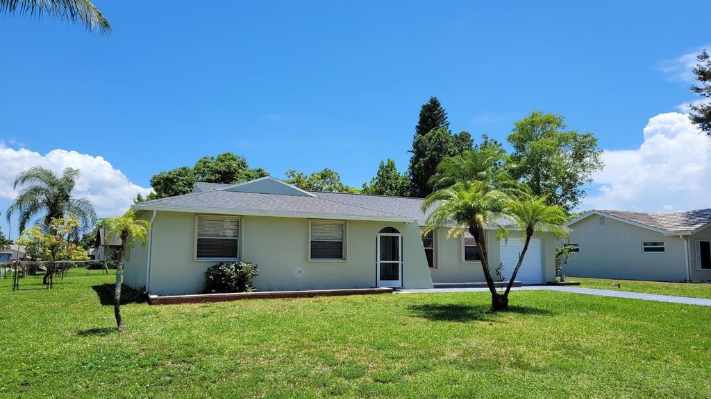 Photo of 296 Sandpiper Avenue Ave, Royal Palm Beach, FL 33411 (MLS # R10816197)