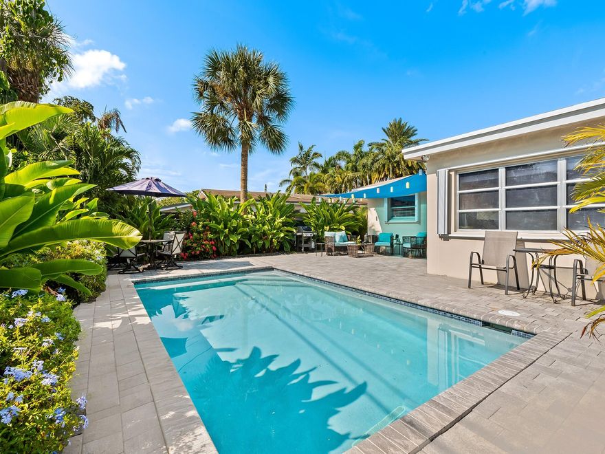 BEST PRICED WILTON MANORS MID CENTURY GEM...LOTS TO LOVE IN THIS RENOVATED POOL HOME...UPDATED LIGHT GRAY PORCELAIN TILE FLOORS THROUGHOUT...UPDATED KITCHEN WITH NEW CABINETRY, COUNTERTOPS, SS APPLIANCES, UNDERMOUNT SINK, PLUMBING AND LIGHTING FIXTURES...RELAX AT THE BREAKFAST BAR...OPEN CONCEPT FLOORPLAN FEATURES LIVING, DINING, FAMILY, AND KITCHEN...2 BRIGHT AND CHEERFUL BEDROOMS WITH UPDATED BATH...STACKABLE WASHER AND DRYER AND 2ND BATH IS A MODERN CABANA BATH WITH ACCESS TO THE POOL AND BACKYARD...2018 HEATED SALTWATER POOL WITH WATER FEATURE, LARGE PAVER POOL DECK, PATIO, & LANDSCAPE LIGHTING...BRAND NEW ROOF 2023, SEWER PIPES COMPLETELY REPLACED UNDER THE SLAB, UPDATED ELECTRIC, NEW ASPHALT DRIVEWAY, WELL IRRIGATION ON TIMER WITH GROUND WATER MINERAL TREATMENT SYSTEM...WORTH A LOOK!