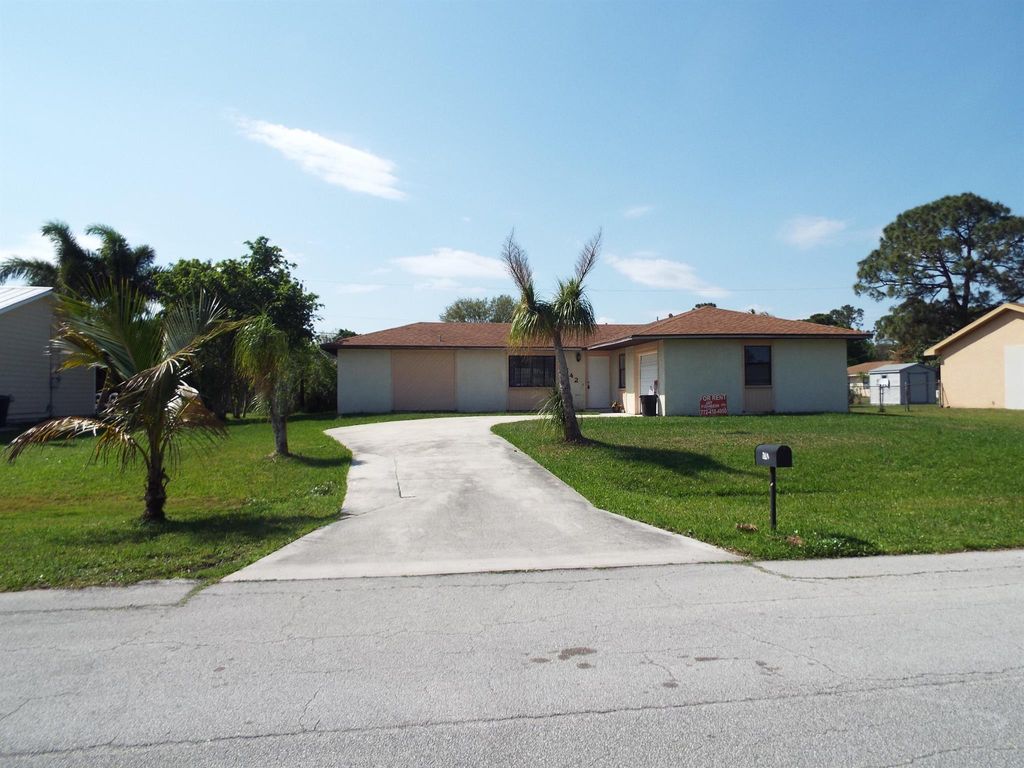 Photo of 1742 SW Garnet Street, Port Saint Lucie, FL 34953 (MLS # R11118483)