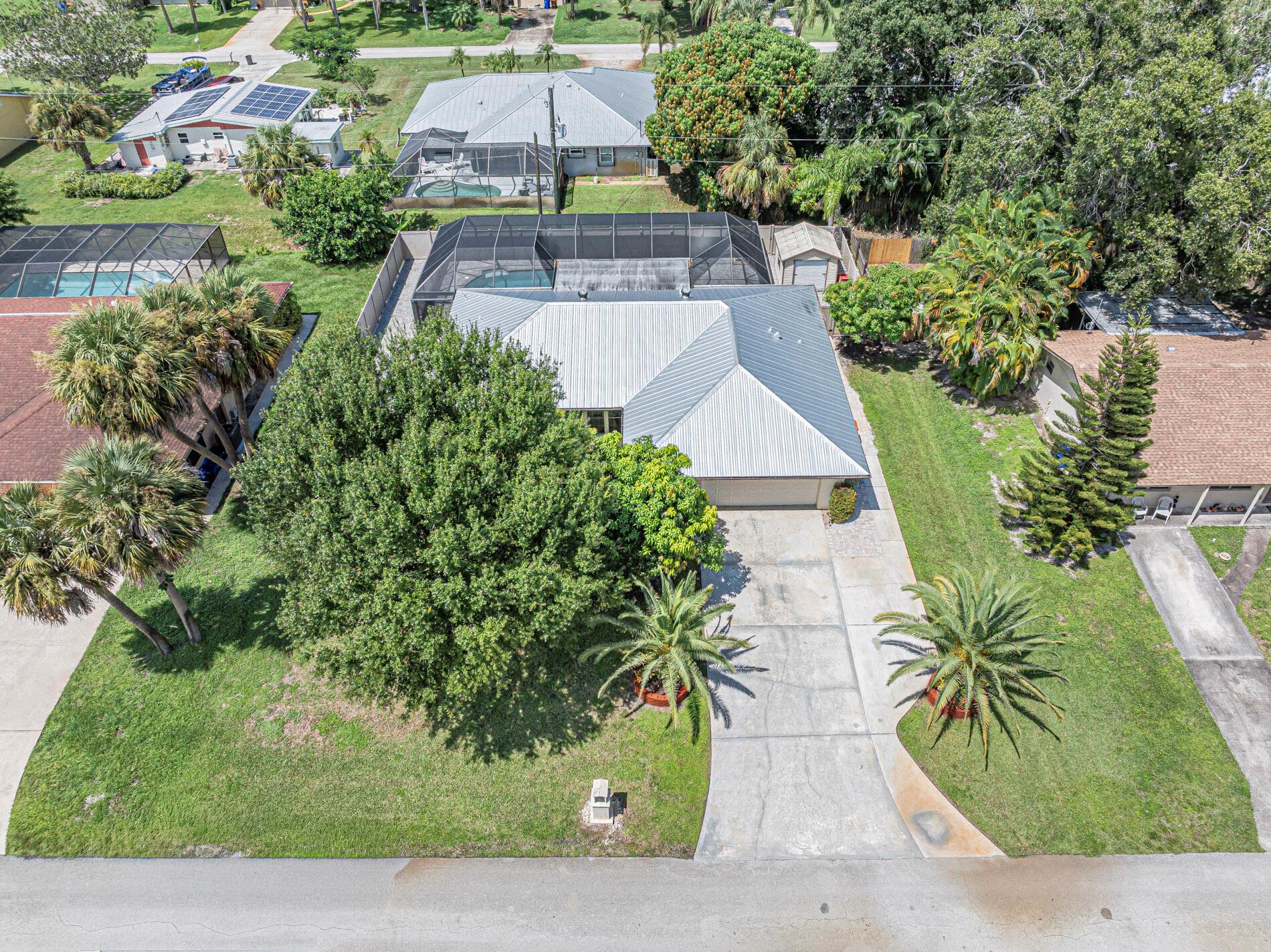 Vero Beach Terrific Location & neighborhood, No HOA, Minutes to River & Beaches. 2020 Metal Roof, 2025 AC & WH. Impact windows, Bright Open Concept, Split Plan, Renovated Kitchen, New SS Appliances, tile thru-out, Pool w/ Extra Large Patio & Pavers, Privacy fence, Oversized lot, Extra driveway space.