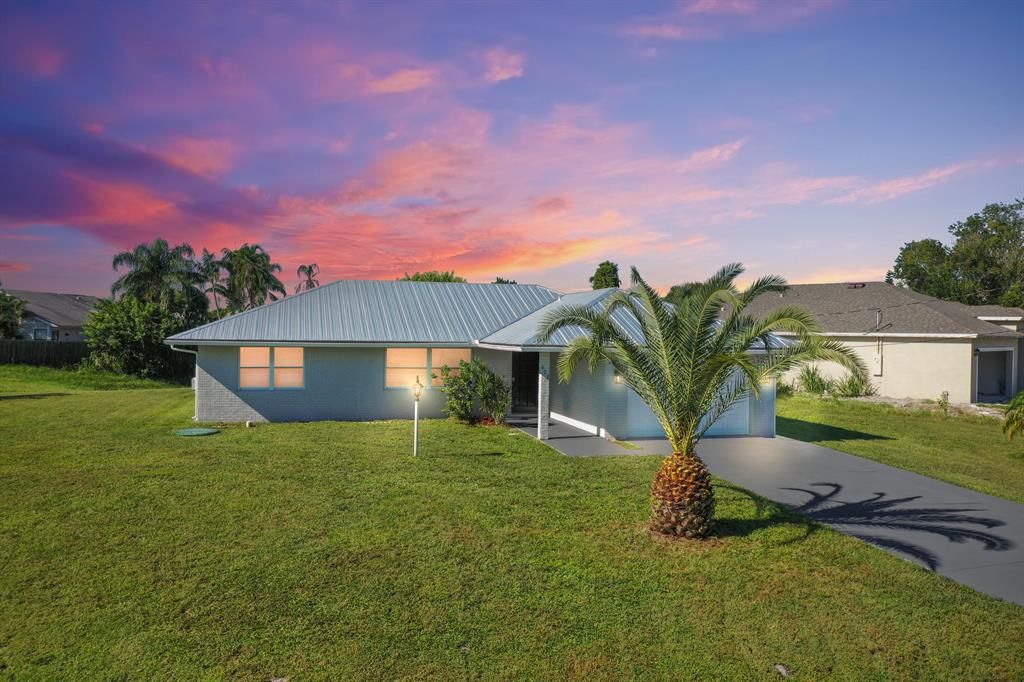 Photo of 602 SW Violet Avenue Ave, Port St Lucie, FL 34983 (MLS # R10831865)