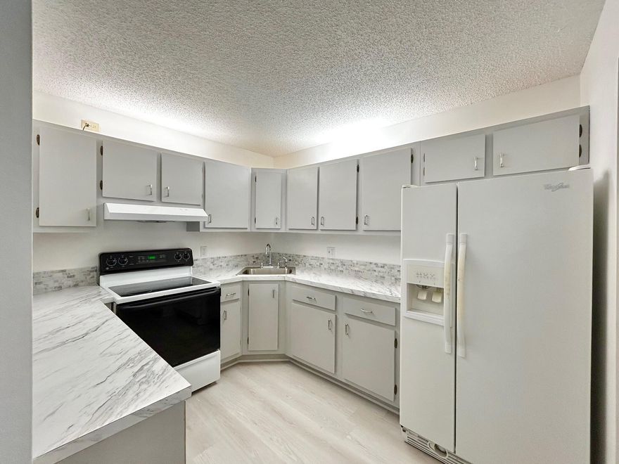 LOCATION LOCATION!!! 1ST Floor corner condo located right across from the clubhouse and pool. Charming and updated with new vinyl flooring, fresh paint, new electrical, new screening, new cordless blinds and new shower doors. Community offers heated swimming pool, walking paths around the lakes, clubhouse, shuffleboard, planned activities, parties and more. Come join the fun!!! Close to shopping, medical, I95 and BEACHES.