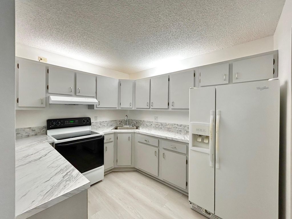 Photo of 102 Lake Pine Circle #D-1, Greenacres, FL 33463 (MLS # B26023343)