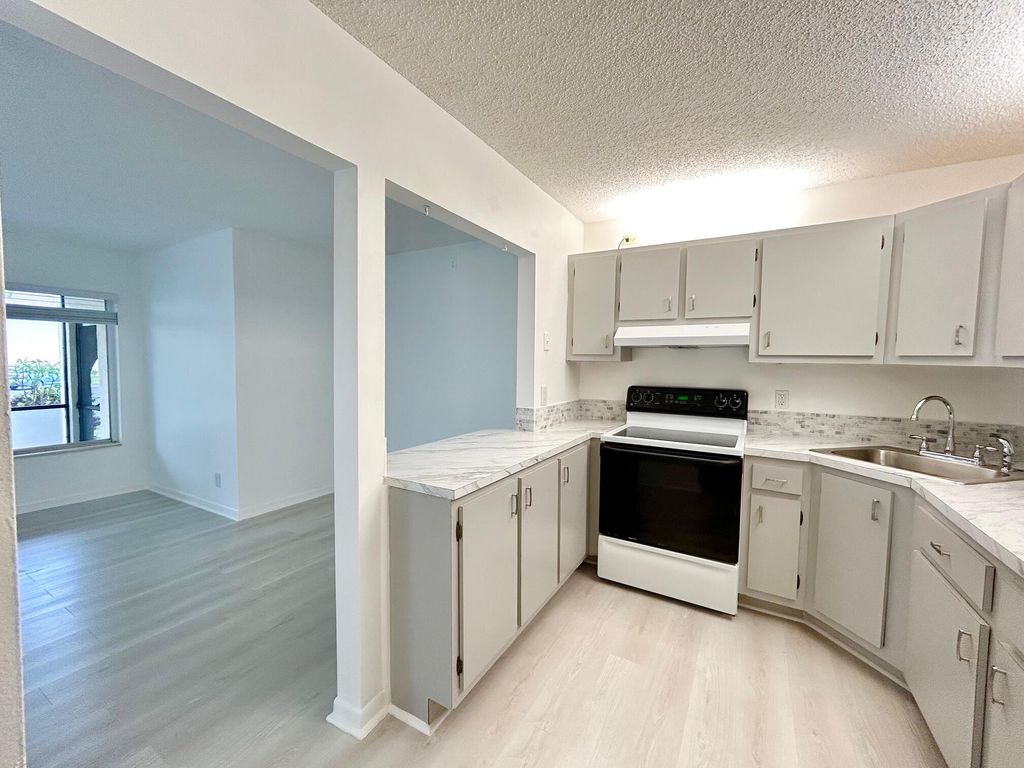 Photo of 102 Lake Pine Circle #D-1, Greenacres, FL 33463 (MLS # B26023343)
