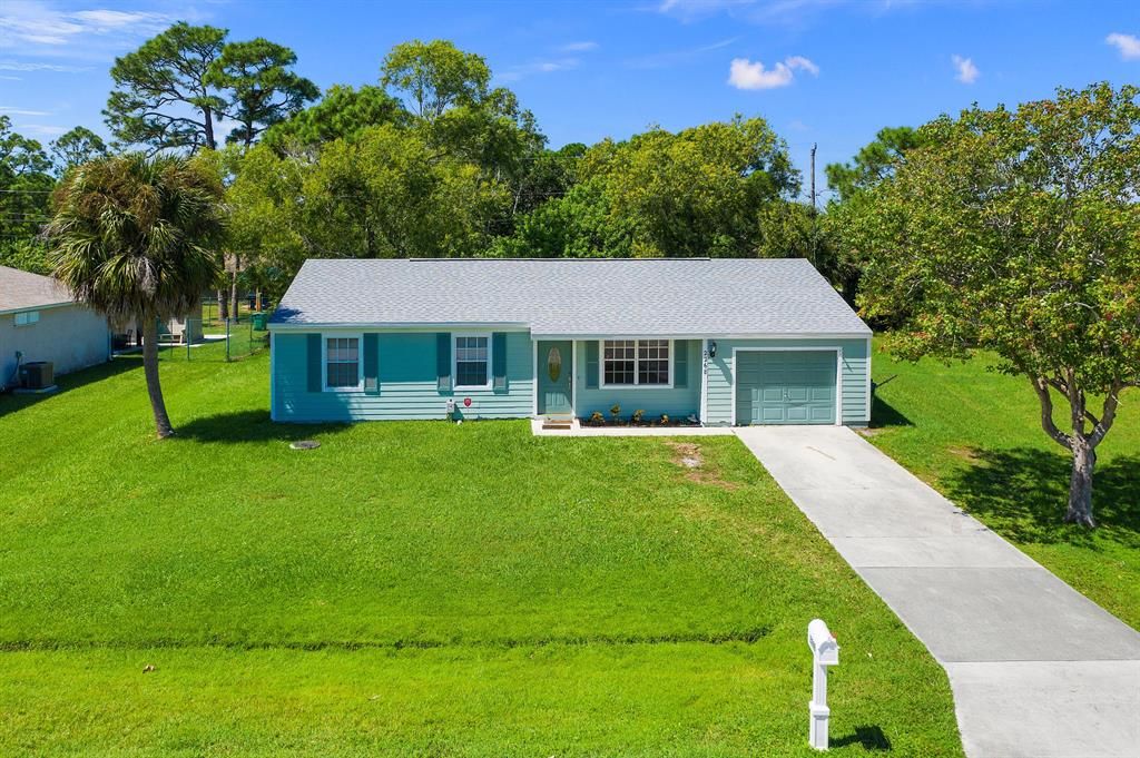 Photo of 2268 SE Merrill Road, Port Saint Lucie, FL 34952 (MLS # R10750046)