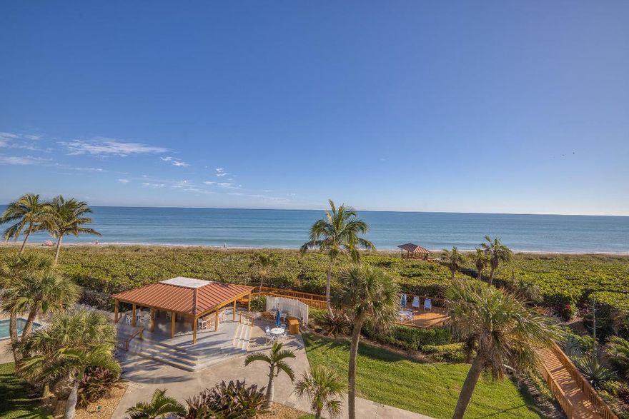 Luxurious oceanfront living awaits in this fully furnished, beautifully updated 2-bedroom residence at the prestigious Island Club. Floor-to-ceiling, impact-rated windows showcase sweeping ocean views and fill the home with natural light. Tile flooring throughout enhances the refined coastal aesthetic. The open concept kitchen features modern appliances, generous counter space, and flows seamlessly into the living area. A private walk-in laundry room adds everyday convenience. Island Club offers an upscale, resort-style lifestyle with manicured oceanfront grounds, a heated pool and spa, elegant lounging areas, and premier indoor amenities including a fitness center, sauna, and stylish social and game rooms. A rare opportunity to enjoy refined, resort-style oceanfront living.