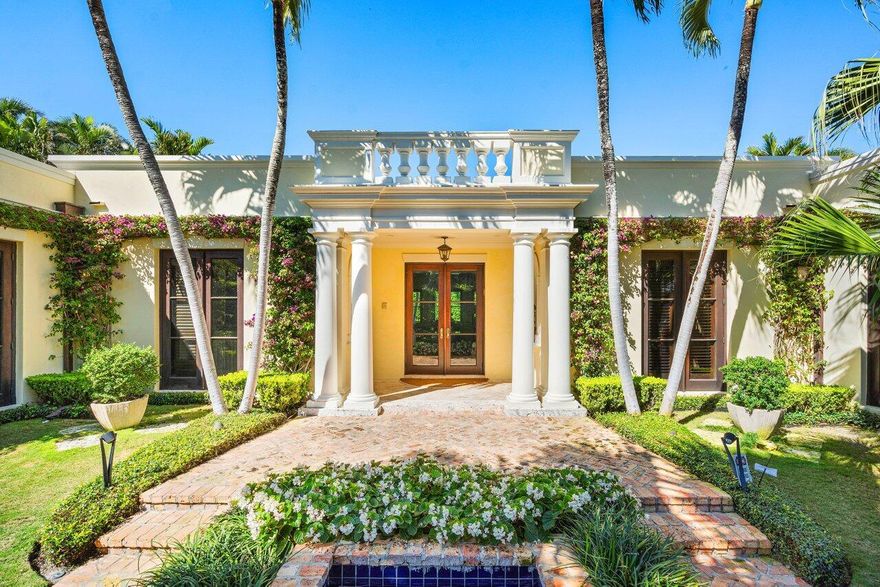 Perched on a ~20 foot elevation on a 12,500-square-foot lot with beach access in the prestigious North End of Palm Beach. This meticulous 4 bedroom, 4.5 bathroom English Regency home was designed by an AD100 designer and transformed into this single-story residence featuring high ceilings, gracious proportions, and elegant molding and details throughout. There is a formal dining room, a spacious library/den, powder room, skylight, and an expansive primary bedroom with dual closets and bathrooms, along with an office/sitting room that opens onto a large loggia perfect for dining, entertaining, and relaxation overlooking the 45-foot lap pool with a hot tub. Chef's kitchen, butler's pantry, laundress station, pet spa, staff quarters, mature landscaping, & two-car garage complete the offering.