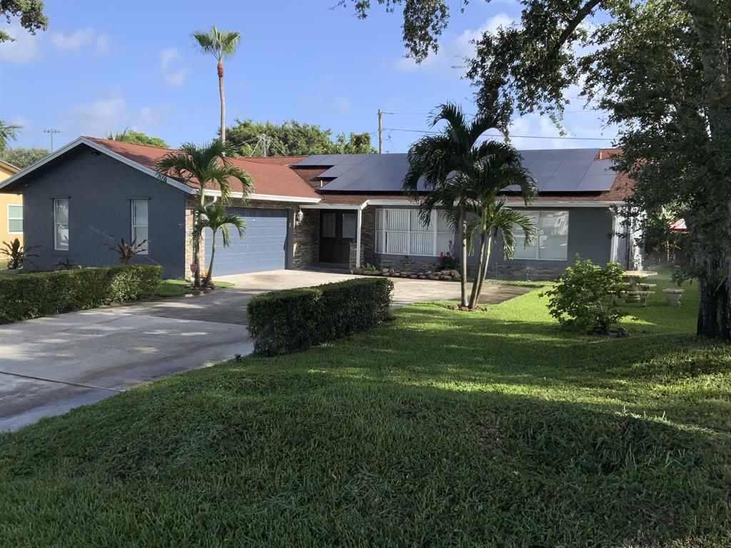 Photo of 3513 Palomino Drive Dr, Lake Worth Beach, FL 33462 (MLS # R10819936)