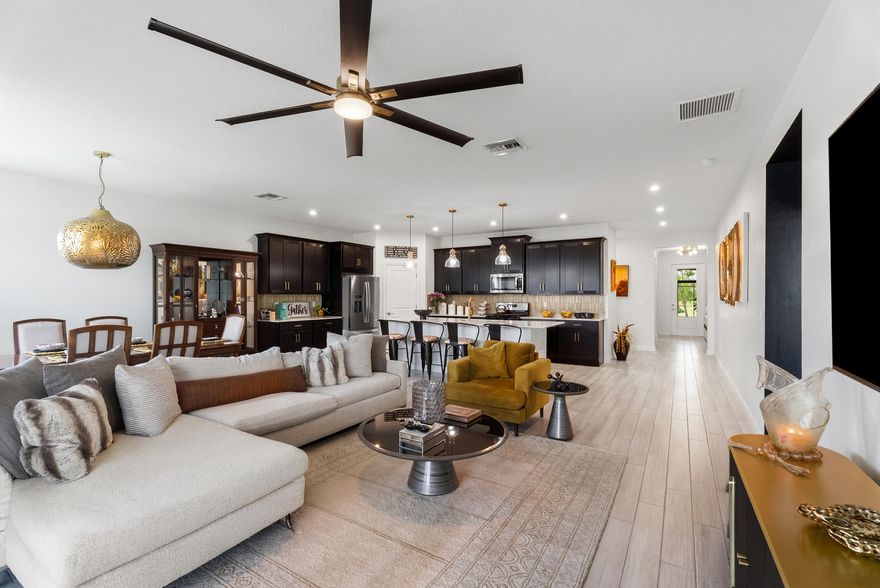 Tucked away on a quiet cul-de-sac in the heart of Tradition, this beautifully upgraded 2023 home offers the lifestyle plus a 2-1 rate buy-down opportunity through the preferred lender. Enjoy resort-style amenities including a pools, cabanas, event lawn, grilling stations, electric bike share, sidewalks, and access to Tradition's scenic T-trails, all minutes from I-95, Tradition Hospital, shopping, dining, gyms, and the newly opened Legacy K-14 school. This 4-bedroom, 3-bathroom home offers over 2,200 living sq ft with impact windows and doors, high ceilings, custom carpentry work, luxury finishes, fenced backyard, and an extended screened lanai with pavers. Built with energy efficiency in mind to help lower ownership costs. Why wait to build when many upgrades are already done for you?