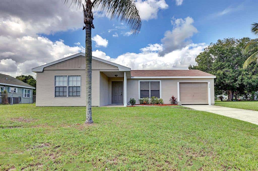 Photo of 229 SW Kimball Circle, Port Saint Lucie, FL 34953 (MLS # R10760602)